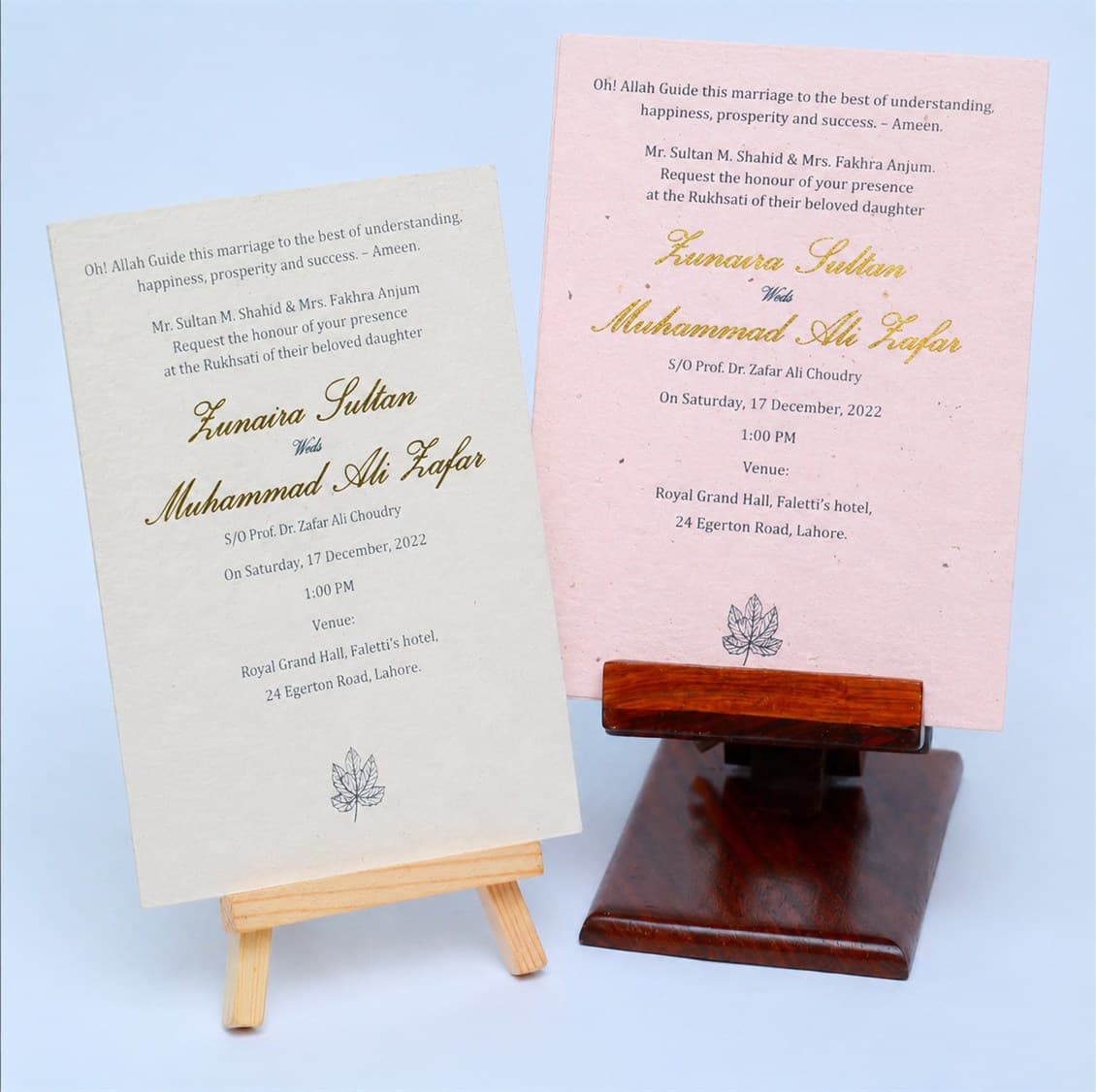 Elegant plantable seed-paper wedding invitation cards displayed on easels